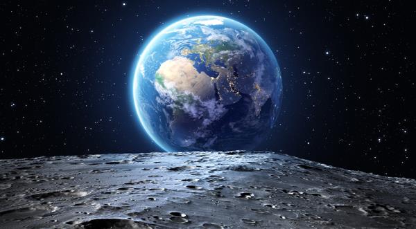 The surface of the moon with earth in background